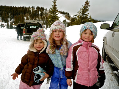 Happy kids sledding in winter - great outdoor recreation and free idea.