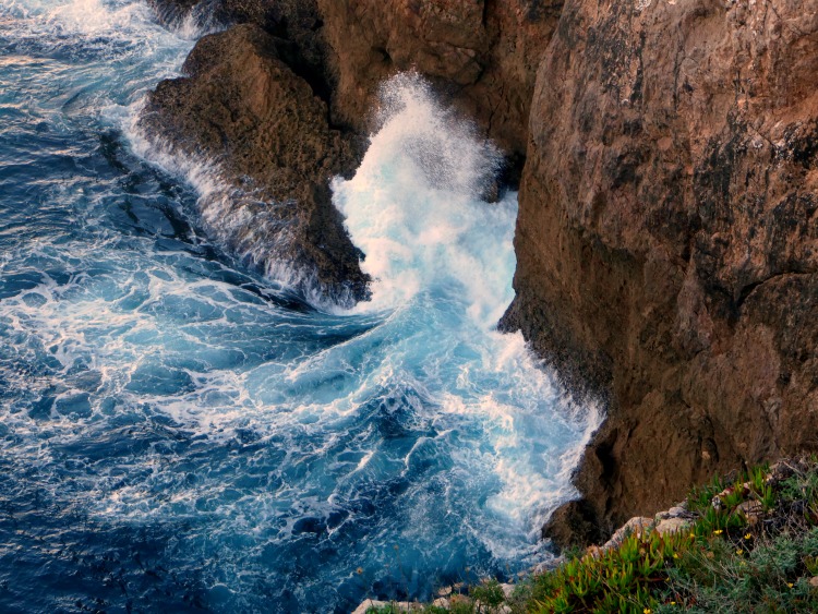 Crashing waves of the Atlantic Ocean against Portugal's Algarve coastline.